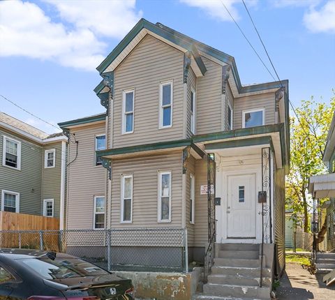 Photo of 492 Fletcher St, Lowell, MA 01854 (MLS # 73511911)