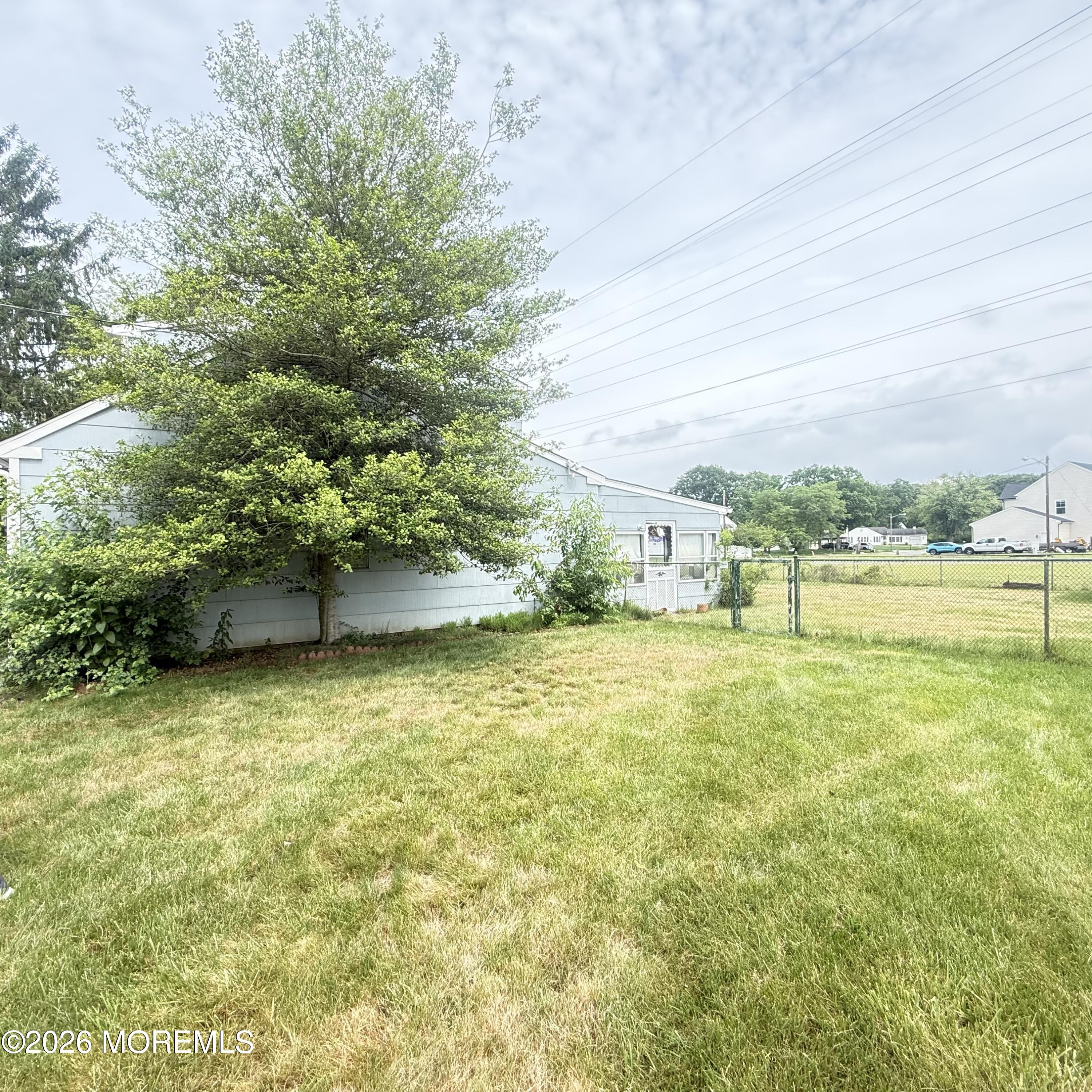side yard of spacious corner property