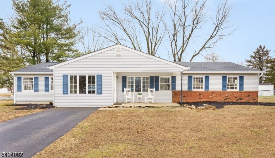 Welcome home to this unique corner lot with 2 buildings in the highly sought-after Brakeley Park section of Lopatcong! This beautiful, spacious, expanded RANCH has a large, welcoming foyer and offers 3 great sized bedrooms with a large walk-in closet off primary, 2 full-baths featuring an en-suite off primary w/double sinks and separate shower stall, kitchen, dining room, large living/family room accented by charming knotty pine walls and hardwood floors throughout, and separate laundry room. This property also includes a rare DETACHED OUTBUILDING with a 2 car garage & 2 room loft upstairs, ideal for a game room, home office or studio with an extra ground-level room w/sliding glass door. What a standout exceptional feature! Step outside the main residence to enjoy a private patio, perfect for entertaining. Both the ranch and outbuilding boast NEW ROOFS, GUTTERS and SOFFITS and DUAL DRIVEWAYS provide ample multi-vehicle parking. The landscape around home was recently mulched and prepped for spring/summer planting!  Additional highlights include central air, gas heat, public water/sewer, and a FREE 1-YEAR HOME WARRANTY covering the main ranch's plumbing, electric, appliances, cooling and heating (see policy for coverage details). Conveniently located within walking distance to the elementary school and golf courses. Just minutes from commuter routes, shopping, and local attractions. This property truly offers the best of comfort, flexibility and location. DO NOT MISS THIS ONE!