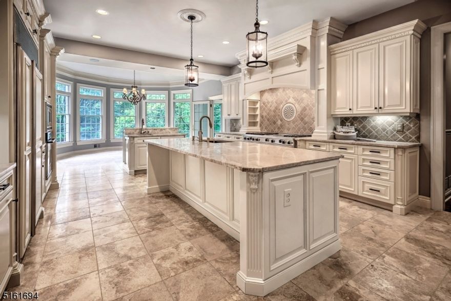 Classic center hall colonial fit for a Gatsby-era ball!  In the past two months new owners have transformed the home and property into a tranquil oasis. Two levels of oak floors and stairways gleam with new finish. Walls, ceilings, and trim boast newly painted neutral modern hues. Bathrooms are refreshed and delightful.  This home?s elegant floor plan flows seamlessly from the graceful, herringbone-floored, double-story curved entry. To the left is a grand living room with oversized windows, stately fireplace, and custom inlaid floors. To the right is the generously-sized formal dining room. Ahead is a central corridor which runs the full length of the home and leads to the ballroom-sized family room with gas fire place. Through the French doors you will find a two-tiered stone patio, lush rear yard and heated saltwater pool. The expansive kitchen has new quartzite counter tops, newly refinished artistically detailed cream cabinetry with new hardware, and new pendant chandeliers above the 9.5 ft main island.  Sun room, wood-paneled office, powder room, full bath, additional office or guest room, pantry and laundry room complete the first level.  The second level boasts a true primary suite with two large newly fitted walk-in closets, a sitting room with gas fireplace, a luxurious bath, and much more. The home is move-in ready with too many updates and features to list (available upon request). Be prepared to be impressed!