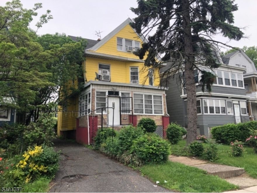 This Classic 2 Family has beautiful natural wood, hardwood floors, 2 furnaces & separate electric, 3 car garage. As is condition.