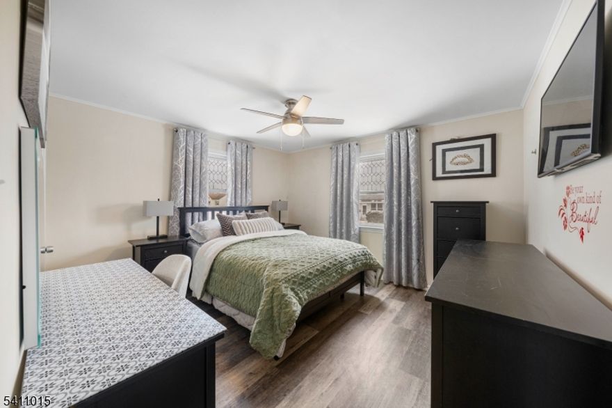 Welcome to this charming Cape Cod, thoughtfully updated in 2019 with modern finishes that make everyday living feel special. From the moment you're inside, you'll appreciate the warm, welcoming atmosphere and the care that has gone into every detail of this home. The main level flows beautifully from the inviting living room into the dining area and a kitchen featuring gray shaker cabinets, spacious countertops, subway tile backsplash, and stainless steel appliances ready for everything from weeknight dinners to weekend entertaining. Two comfortable bedrooms and a stylish full bath round out the first floor. Head upstairs to find two more generously sized bedrooms and a second full bath set up for guests, a home office, or a cozy hangout space with charming vaulted ceilings. The finished basement is a true bonus, offering a spacious family room, a third full bathroom, and a dedicated laundry room. Outside, enjoy a private, fenced backyard with a patio and storage shed, prime for summer gatherings, outdoor dining, and everyday living. Commuters will love the unbeatable location just off Vauxhall Road with local buses steps from your door, quick access to Route 22, and the Garden State Parkway just minutes away. This move-in ready home truly checks every box: space, style, and convenience.