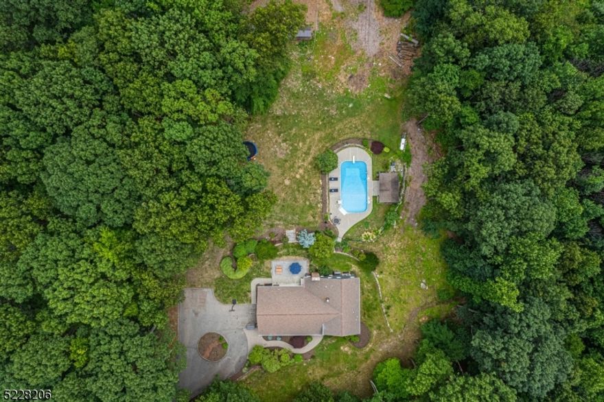 A beautiful home awaits you in sought after Lake Valhalla! This property truly checks all the boxes. Offering over 3300 sqft of living space across 3 floors & an absolutely perfect floorplan. Formal living room and dining room full of light. Eat in Kitchen equipped w/breakfast bar, high vaulted ceilings and slider to back patio. Family room with showcase brick fireplace. Stunning OPEN & bright layout. An ideal home for everyday living and entertaining. Upstairs offers a primary suite with a full bath & walk-in closet. 3 additional generous sized bedrooms & full bath complete the 2nd floor. Ground level boasts a rec room, two flex rooms- office or den, full bath & laundry. TONS of storage in the walk up attic, with potential to finish. Stunning backyard! A private oasis designed to perfection. Stone patio, heated in-ground pool, pool house, tons of lawn space and shed all surrounded by acres of wooded bliss. It doesn't get any better than this. 2 car garage and plenty of parking in driveway and long, quiet street. Top rated schools, easy access to major highways, shops & restaurants, bus & train direct into NYC. Totally Move-In-Condition. Just unpack & begin to enjoy on day one, all this home, neighborhood & Montville has to offer.