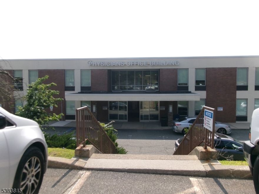 1000 sq. ft. 1st floor office condo, previously a medical use. Newer Carpeting and ready for paint. There are 3 exam rooms, private office, waiting room and reception room, and large procedure room or conference room.  Each outside room also has auxiliary heat & A/C. The front portion of the office is Hot air.