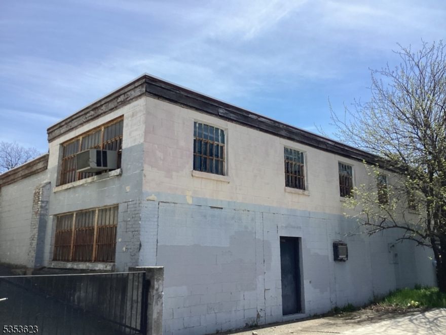 Opportunity knocks! This 150' x 150' lot (22,500 sqft) features an 8,500 sqft building across two floors, including a convenient drive-in door and 8- 13ft ceiling heights. Perfect for an owner-occupant or a new business looking to customize their own space. The building needs work and is ideal for renovation, redevelopment, or a complete repositioning to fit your needs. Value is primarily in the land   excellent location with plenty of possibilities for users or investors alike. Property being sold AS IS