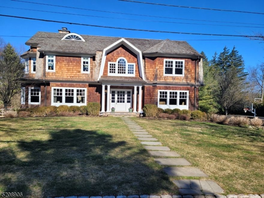 This custom home, built on the original and expanded foundation will WOW you from the moment you arrive.  Located on The Pond in Old Short Hills this house was lovingly designed & curated by its current owners. No detail was overlooked.  From the custom windows, wide planked wood floors, high end fixtures & finishes everything was hand picked to create a spectacular environment. Featuring a spectacular Chef's Kit w/High End SS Appl, Oversized Island w/Danby Marble Countertop, Italian Tile Backsplash, custom cabinetry, gorgeous hardware & a sunny breakfast area.  Access from the kit. to the raised deck w/pergola makes al fresco entertaining a breeze! The custom bathrms are outfitted w/Water Works fixtures.  The1st fl also boasts a lg home office w/custom built-ins, A grand DR perfect for hosting, a beautiful formal LR & a Great Rm open to the kit w/views of the pond.  Upstairs the primary suite is the ultimate refuge after a hectic day & a birds eye view of the pond greets you every morning.  Complete with a gas fp, his/hers closets & gorgeous ensuite bath w/jetted tub, shower & dual vanities. 3 more spacious bedrooms & 2 bathrms (1 ensuite) & laundry rm round out the 2nd fl. The third level features a bedrm, full bath, sitting room & tons of storage. The finished LL features a diner themed eating/game area, home gym & cozy media/rec rm.The lg side yard provides plenty of room to play. The firepit area is the perfect spot to gather on a beautiful evening.
