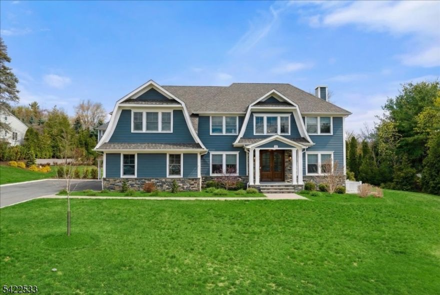 Custom-built center-hall colonial, just 5 years young & nestled in one of Bergen County's most coveted communities: Wyckoff. Renowned for top-rated schools, recreation, NYC transp, fine dining, & shops. This meticulously crafted home makes an unforgettable first impression with its striking HardiBoard & stone exterior, paver patio w/firepit, & gorgeous double front door entry. Every inch reflects thoughtful architectural detail; red oak HW, intricate millwork & tray ceilings. The two-story entry foyer adorned w/herringbone HW floors flows seamlessly into a traditional yet open layout. The formal LR opens gracefully to a warm and inviting FR, complete with custom cabinets w/built-in shelving, gas FP, & coffered ceiling. The open-concept design is an entertainer's dream, extending naturally to chef's kitchen featuring center island, quartz countertops, Dacor appliances, & sliding doors leading outdoor patio. Upstairs, the luxurious primary suite offers two spacious WIC and a spa-inspired en-suite bath. Two additional BR's are thoughtfully connected by a dual bath featuring double sinks & a private water closet. A fourth en-suite BR boasts its own elegant bath w/herringbone tile. Completing the 2nd floor is an oversized laundry w/cabinetry & quartz. Unfinished basement w/3windows (one egress) & plumbed for future bath for rec rm. Amenities:sprinklers, heated garage, multi-zone HVAC, municipal water and sewer, & generous .518-acre lot w/room for pool. Owner has RE license.