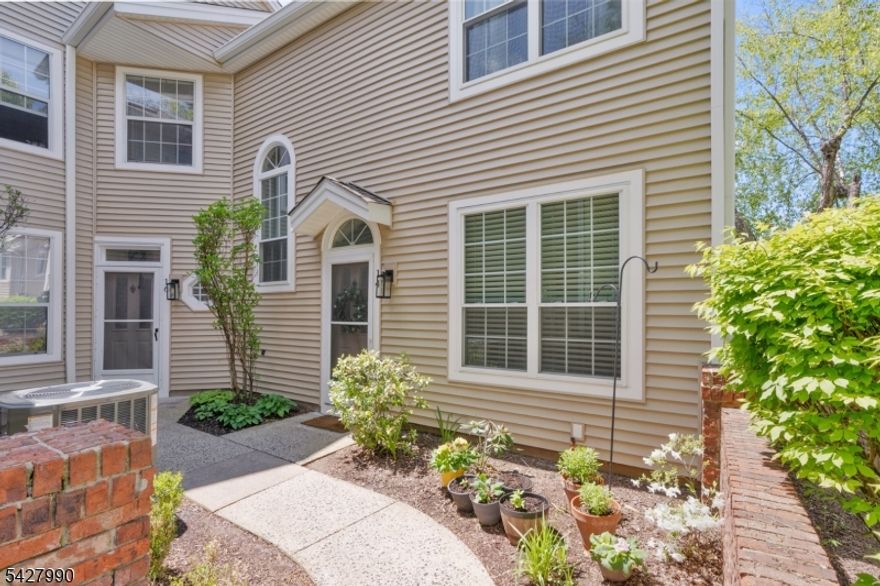 This beautifully updated, bright carriage-style end-unit townhome in sought-after Wood Duck Pond is truly a must-see. Offering 2 bedrooms and 2.1 baths, the home features soaring ceilings, rich wood flooring, an updated powder room, a wood-burning fireplace, and a convenient first-floor laundry room.Both bedrooms include walk-in closets and private en-suite bathrooms, filled with natural light and offering lovely sunset views. The kitchen has been refreshed with refinished cabinetry, new flooring, quartz countertops, and a water filtration system. All bathrooms have been recently renovated with a clean, modern feel.As an end unit townhouse there is plenty of privacy with new windows, and abundant natural light throughout, along with an open, spacious layout and peaceful views from the family room and kitchen.Wood Duck Pond Development enjoys access to tennis courts, an exercise room, and a seasonal outdoor pool, all included, plus a clubhouse available for private events. Conveniently located near major highways and scenic trails. Additional storage is available in the garage.No pets or smoking permitted.