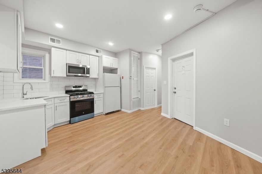 Located in the heart of Passaic, 57 Henry St #A1 is a newly renovated 2 bedroom apartment featuring bright LED lighting, modern kitchen with stainless steel appliances, spacious bedrooms on opposite ends for maximum privacy, and a modern bathroom with beautiful finishes throughout. Enjoy laundry facilities in the basement, and close proximity to Main Ave with a plethora of options for shopping, dining, nightlife, and easy access to public transportation. Rear yard completed with a playground, seating & entertainment space. *Free storage for 1 year for qualified applicants. Inquire for a private tour today.