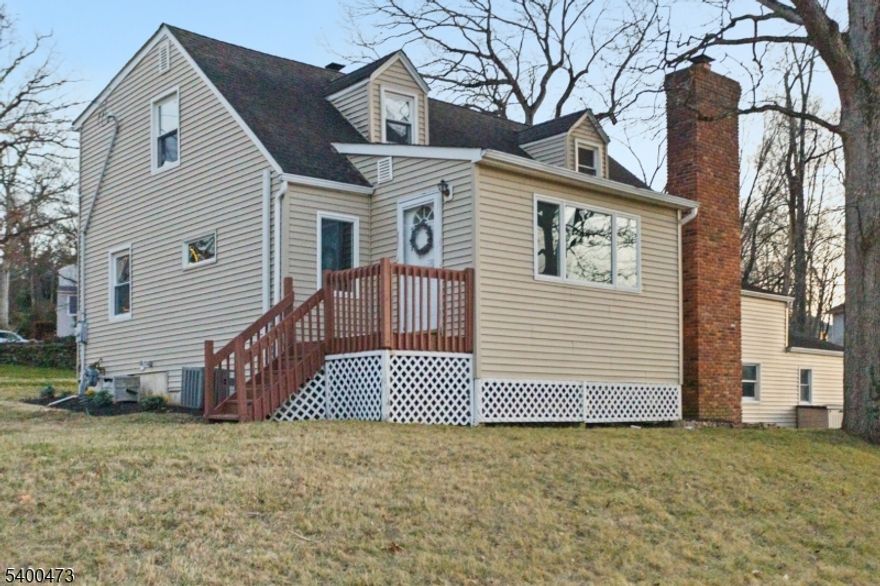 Welcome home to this beautifully renovated expanded Cape Cod, perfectly nestled in one of Watchung's most treasured settings directly across from the peaceful waters of Watchung Lake. Every morning feels a little more magical here, with picture-perfect views right from your living room windows, letting the light dance in and making the whole space feel calm, grounded, and connected to nature.Step inside and you'll find a custom eat-in kitchen designed for gathering, quartz countertops, timeless finishes, and thoughtful details that make everyday meals feel special. The main level offers two spacious bedrooms with a warm, comfortable feel, while the second floor adds three more charming bedrooms and a beautifully updated full bath, giving everyone their own cozy corner of the home.Downstairs, a large, open, finished basement creates the perfect flex space movie nights, a playroom, a home gym, or all of the above. An attached garage adds convenience, and the generous lot opens to a lovely paver patio just off the kitchen, ideal for morning coffee, weekend barbecues, or quiet evenings unwinding outdoors.Just a short walk brings you to the park with its gazebo, tennis courts, playground, and wide-open spaces, an extension of the lifestyle this home offers: peaceful and meant to be enjoyed. This is more than a house. It's a place to slow down, take in the lake views, and create a life that feels both inspiring and deeply comforting. Welcome to your Watchung retreat.