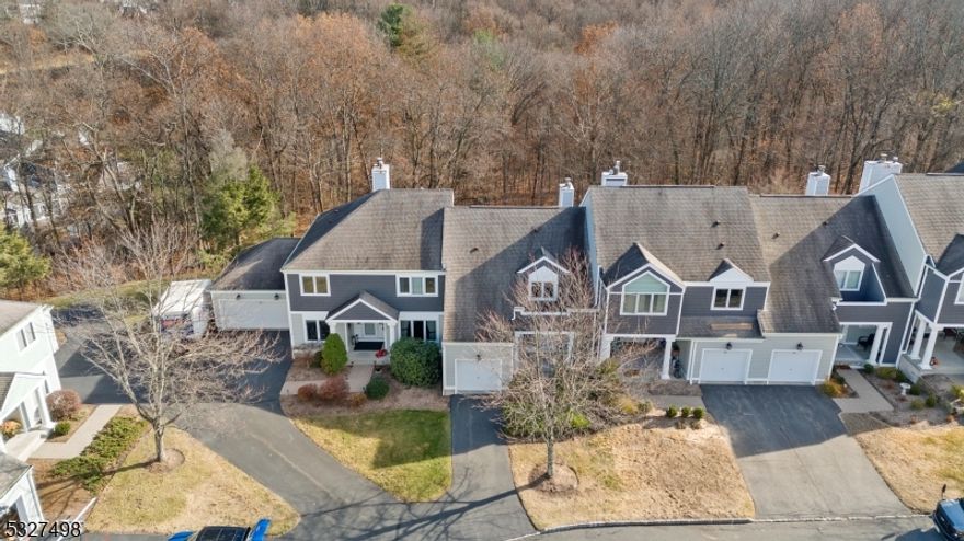 Experience this beautifully appointed 2 Bedroom, 2.5 Bathroom Townhome located in Greentree Village, a 24/7 Gated Community in Sparta NJ with unparalleled amenities. This is a "must see" if you're looking for a safe & peaceful environment. Upon entry you are greeted by an Open-Concept Floor Plan with oversized windows, sliding doors, and skylights showering this Unit with natural light. The First Floor features a soaring 2-Story vaulted ceiling Living Room with a warm and cozy natural gas Fireplace, an Eat-In Kitchen with Breakfast Bar including Granite Countertops, custom Backsplash & Stainless Steel Appliances, a separate Formal Dining Room, and Powder Room. On the Second Floor you will find 2 spacious Bedrooms and 2 Full Baths including a Primary Bedroom with an En-Suite Bathroom with Dual-Vanity Sink, Stall Shower, Walk-In Closet and your own private Balcony Deck that looks over a peaceful ravine. The Full Unfinished Basement has high ceilings and is your canvas awaiting your creativity. Recent upgrades include conversion to natural gas, a new furnace, water heater, air conditioning, fireplace insert, kitchen upgrades, new washer and dryer, new garage door & a porch resurface. Greentree Village offers a Swimming Pool, Tennis Courts & Clubhouse. SPARTA OFFERS THE #1 SCHOOL SYSTEM in Sussex County. Close by the renowned Crystal Springs & Mountain Creek Resorts offering a Ski Resort, Waterpark, Mountain Bike mountain, 7 premier Golf Courses, Top-Rated Dining & much more!