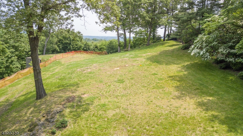 For those seeking the extraordinary, look no further than this spectacular property with dramatic scenic views of the New York City skyline, nestled on nearly 2 full acres of complete privacy on a prestigious cul-de-sac in the esteemed Northside of Summit NJ. Breathtaking views from every turn await those at the pinnacle of success who appreciate the possibilities that only a truly special location can offer. Imagine enjoying morning coffee while gazing over rolling hills or hosting al fresco evening dinners with twinkling NYC lights as the backdrop. The possibilities are endless and await that very fortunate buyer. Ready for building an ideal retreat from daily life with easy access to top rated schools, Summit's lively downtown and NJ Transit's Midtown Direct service to NYC.
