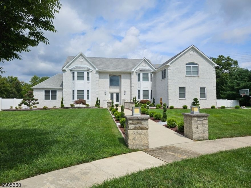 Welcome to 19 Adam Ct in Monroe, a luxurious contemporary home at the end of a quiet cul-de-sac, set on 2.5 acres of meticulously maintained land. This 6bed, 5bath residence is truly high-end living, with every detail thoughtfully designed to create an expansive, elegant environment. Lower Level: The walkout basement is bathed in natural light from large windows. It includes a spacious bedroom, a full bathroom with an oversized shower, a modern bright-gloss kitchen with an eating nook, a living room, workout area, bar, and a state-of-the-art movie theater with starry ceiling lights. Surround sound ensures a fully immersive experience. First Floor: The large kitchen with a breakfast bar and eating area opens to a formal dining room. This floor also features a large bedroom, a full bathroom, and a 2-story family room with a grand entrance under a massive chandelier. Additional spaces include an office/formal living room and a sunroom bathed in natural light. Second Floor: The Master suite is a private retreat with a spacious bedroom, an additional sitting room or office, and an oversized bathroom with a chandelier and a free-standing tub. 3 additional bedrooms and two full baths complete the upper level. Outdoor Oasis: The outdoor space is equally impressive, with an inground saltwater pool, jacuzzi, and a swim-in grotto under a waterfall. The expansive backyard includes a soccer field, playground, and string lights and color-changing accents, creating a magical ambiance.