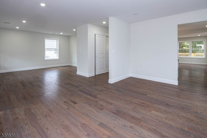 Custom new construction with luxury touches throughout -  covered Trex front porch & steps, Quartz counters, recessed lights, hardwood floors, gas fireplace and a 28' x 10' deck is included at no extra cost. Oversize garage is 25' deep plus there is a large storage room behind it. Low maintenance vinyl siding w/ white Board and Batten accents on the gables. 75' x 125' lot with privacy fence on the right side. Located just 20 minutes from the Outerbridge Crossing. Primary BR has tray ceiling, walk-in closet & spacious bath with double vanity, custom tiled shower w/ bench & linen closet.  Formal DR, LR, Kitchen, Breakfast Room and Family Room offer a great layout to suit many lifestyles. 10 year new home warranty. Home is located in an AE Flood Zone and built above FEMA elevation guidelines to help minimize insurance costs. Some websites are mapping this property to the wrong location.  It is located off Bordentown Avenue not far from Route 18.  Member of seller is a licensed real estate broker in NJ . For GPS and mailing address use Old Bridge, NJ 08857 but property is located in Sayreville.