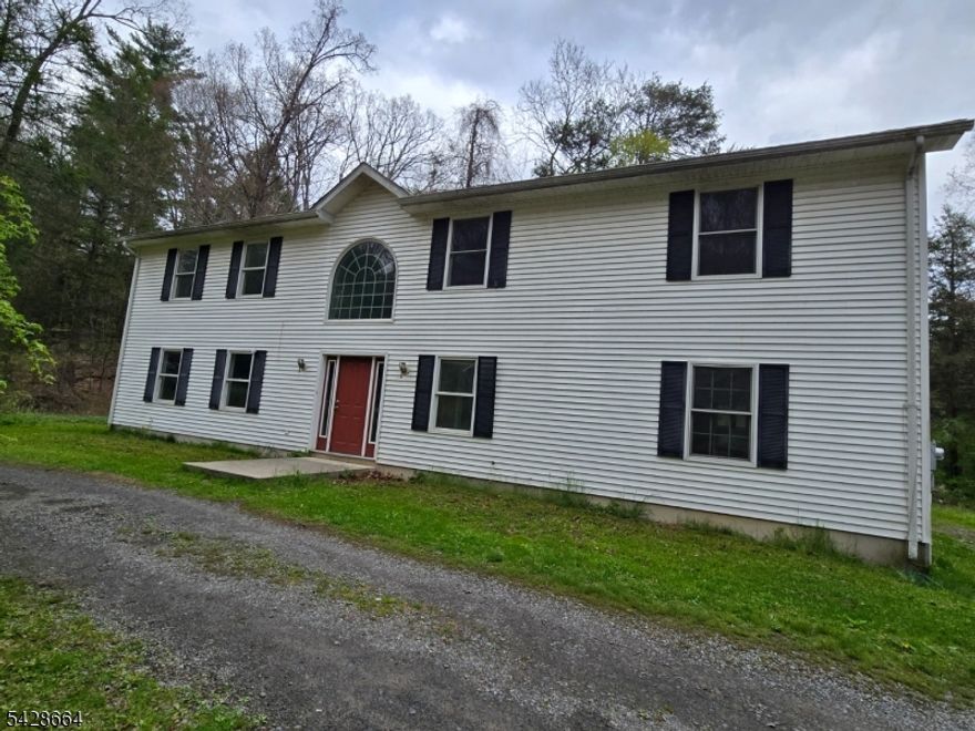 Nestled on a private .99-acre wooded lot, this 2004-built raised ranch offers an incredible opportunity for those looking for a fixer upper. The interior features a spacious layout including 3 bedrooms, 2 full bathrooms, and a large kitchen with a separate dining area that opens directly to the back deck. Partially finished walkout basement with sliders that lead to patio and backyard. Also plumbed for a potential 3rd full bathroom downstairs. 2 car attached garage. Minutes to High Point State Park, Delaware River, and historic Milford Pennsylvania. Close to Routes 206, 23, and 84.