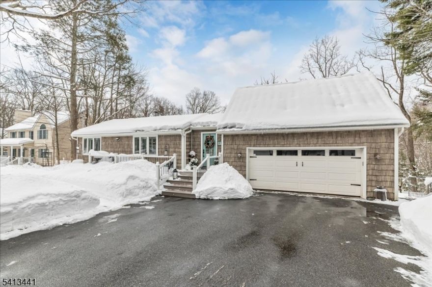 Tucked away in a peaceful, wooded setting, this delightful 2-bedroom ranch offers the perfect blend of style and privacy. A welcoming front porch invites you to slow down and savor the fresh air, while the surrounding trees create a natural sanctuary. Inside, you'll find light-filled spaces ideal for both everyday living and weekend escapes. The yard provides plenty of room for pets, gardening, or simply enjoying the outdoors. This home is your private retreat just minutes from Upper Greenwood Lake, apple orchards, drive-in movie theater, ski mountains, live music, shops, restaurants and so much more.  This property includes a new front porch, back deck, private primary bedroom balcony, fenced yard, ample parking and easy access to endless hiking trails, including the ApplalachianTrail.  This is the property that you've been patiently waiting to hit the market!   Schedule your showing before it's gone!