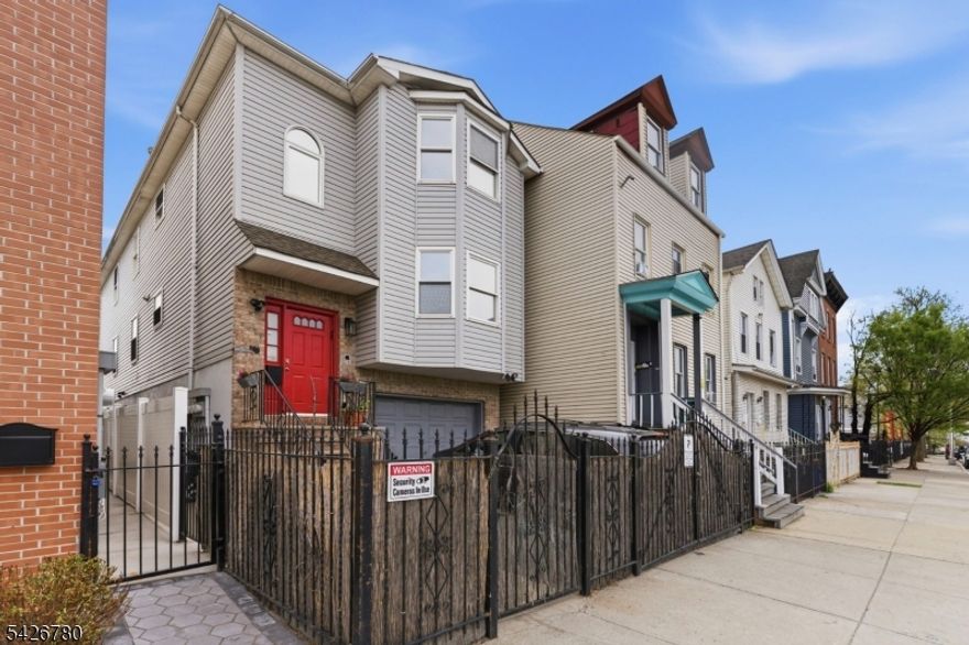 Spacious and modern multi-family home located on Broad Street in Newark's vibrant North Ward. Built in 2009, this well-maintained property offers generous living space with multiple bedrooms and bathrooms ideal for extended households or rental income potential.Unit #1 is currently operated as a lucrative Airbnb by the owner, offering a turnkey opportunity for short-term rental income or flexible owner-occupancy. The home features hardwood and tile flooring, a finished basement, and updated systems including central cooling and gas heating.Enjoy the added convenience of a 1-car garage plus 1 additional driveway parking space, a valuable feature in this area. Close to public transportation, shopping, and schools, this property blends comfort, accessibility, and income potential.