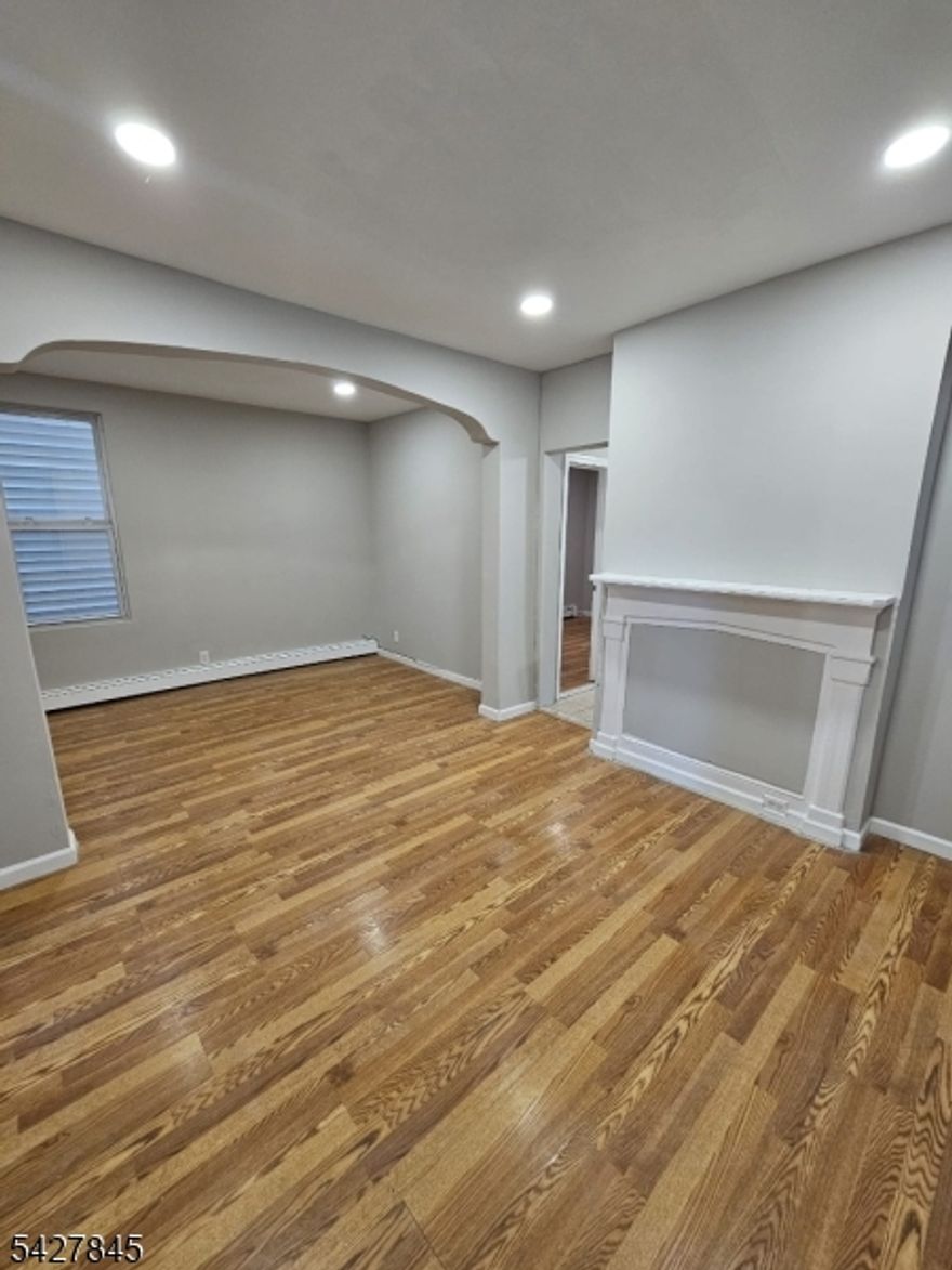 Incredible two-family investment opportunity located on a quiet cul-de-sac in the heart of Elizabeth. This top-bottom style property features two spacious units, each providing 3 bedrooms and 1 full bathroom. The first-floor unit offers a functional layout with a living room, formal dining room, and an eat-in kitchen. The second-floor unit includes a living room and kitchen. Significant additional utility is provided by a finished attic and a partially finished basement. The property also includes access to a yard for outdoor use. Ideally situated near local schools, parks, shopping, and public transportation for a seamless commute. Please note: the second-floor unit is currently occupied and will not be delivered vacant.