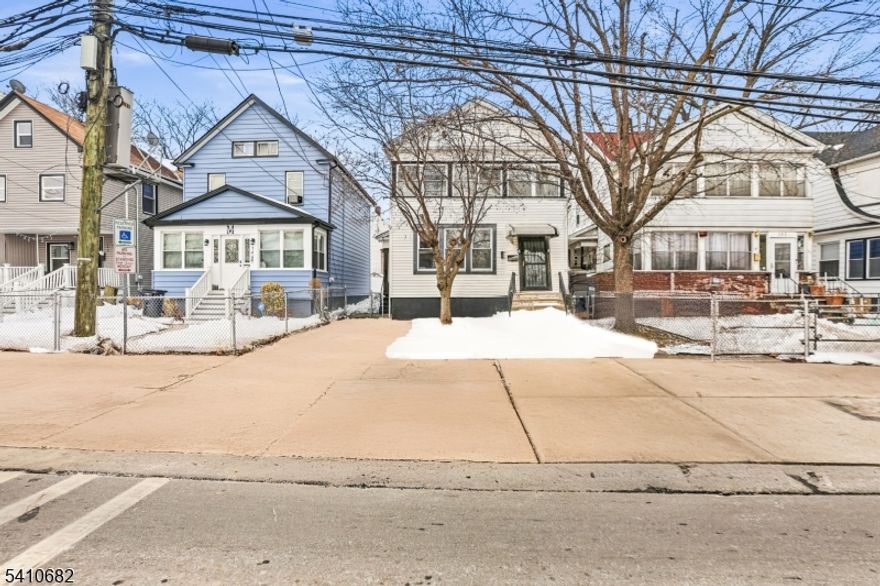 Welcome to 143 Smith St, a beautifully renovated Colonial offering charm, character, and modern updates in Newark. This inviting home features three spacious bedrooms and one full bathroom, beginning with a bright living room accented by a decorative non-functional fireplace, a separate formal dining room perfect for gatherings, and an updated kitchen complete with stainless steel appliances, a breakfast bar, a dedicated dining area, and a half bathroom. The second floor includes three comfortable bedrooms along with a sunroom that adds valuable flexibility for a home office, reading nook, or creative space, and a full bathroom, plus access to a walk-up attic for another bedroom space. An unfinished basement provides even more room for storage, while the thoughtful renovations throughout give the home a clean, move-in-ready feel. Conveniently located near shopping, parks, schools, and transportation, this is a fantastic opportunity to own a stylish and well-updated home. Grab it before it's gone!