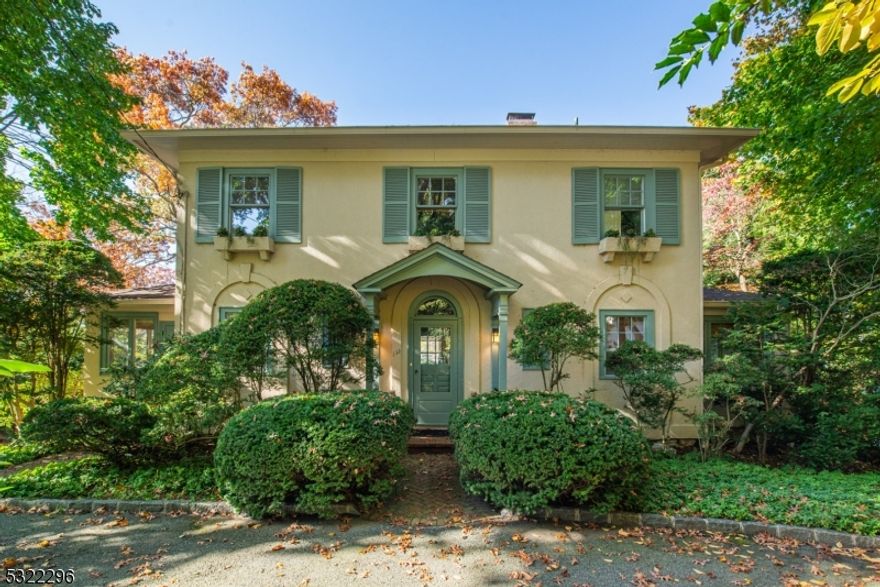 Welcome to this enchanting Belhall Colonial, a timeless treasure built in 1922, on a level .45 acre lot on the shores of Mountain Lake. This home has stunning sunset views & a harmonious blend of classic charm & modern amenities. Beyond the welcoming foyer, you'll be greeted by a formal DR that seamlessly flows into an expansive LR, featuring a wood-burning fireplace. Adjacent to the LR is a delightful guest rm and a full bath w/a shower and pedestal sink. A powder rm is set just off the entrance foyer. Pass through a charming archway to the FR addition, where walls of windows frame glorious lake views. Sliders on either side of the room lead to side fiberglass decks, perfect for enjoying the views. The bright kitchen boasts Corian countertops & SS appliances, complemented by an inviting breakfast rm w/a vaulted ceiling & sliders leading to the deck. The backyard is a captivating retreat w/sweeping lake views & a gazebo by the water's edge. On the 2nd fl, the luxurious primary suite offers stunning lake views thru its expansive windows, along w/built-in shelving, a WIC , & a primary bath w/a dual vanity & tub/shower. 3 more bedrooms share a hall bath w/a shower & pedestal sink, while a laundry rm off the 2nd fl hall presents the potential for an ensuite bath in the future. The LL has a rec rm, a half bath, cedar storage & utilities. Additional features include a 2-car built-in garage, newer AC, roof & newer windows. Enjoy the wonders of this lakefront lifestyle!