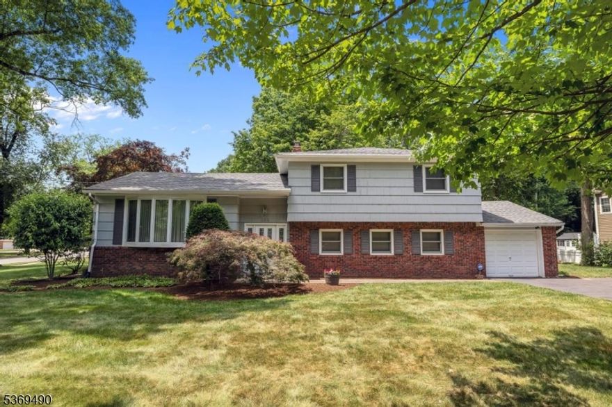 Welcome to this charming Sugar Maple Split-Level home located on the desirable east side of Ridgewood. This well-maintained residence offers 3 spacious bedrooms and 2 full bathrooms, providing comfort and convenience for today's living. Gleaming hardwood floors run throughout the home, adding warmth and timeless appeal. The updated roof (installed in 2024) ensures peace of mind for years to come. Enjoy outdoor living in the lush backyard, complete with a private deck perfect for relaxing or entertaining. A one-car attached garage adds to the home's functionality. Conveniently located near , parks and transportation, this home blends classic design with everyday practicality. Don't miss this opportunity to own in one of Ridgewood's sought-after neighborhoods.