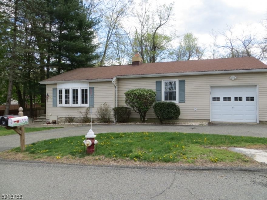 THIS MAGNIFICENT HOME FEATURES, FPL IN LIV RM, HWF & VAULTED CEILING. UPDATED KITCHEN W SS APPLIANCES, BEAUTIFUL LEVEL, OPEN & FENCED BACKYARD W /PAVER PATIO AND CUSTOM SHED. THE HOME IS SITUATED WITHIN WALKING DISTANCE OF THE LAKE. CIRCULAR DRIVEWAY THAT CAN ACCOMMODATE UP TO 6 VEHICLES.  CONVENIENTLY SITUATED TO MAJOR HIGHWAYS, SHOPPING & NYC TRAIN. HOME IS "AS IT IS."