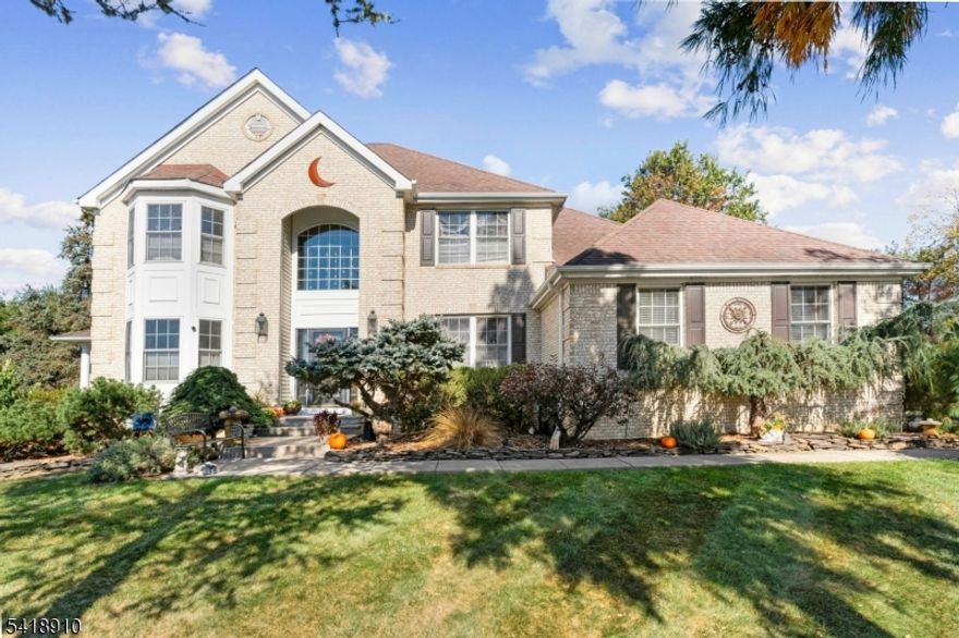 Welcome Home to a Stunning Original Owner brick-front colonial located on a Quiet Cul-De-Sac in the much-sought-after Wyndham Farm at Greenwich. A dramatic two-story foyer opens to a spacious interior w/ a newer kitchen overlooking the family room, featuring 10-foot ceilings, a floor-to-ceiling fireplace, and bamboo flooring, ideal for everyday living and entertaining. Formal living room and dining room with a beautiful bay window overlooking a peaceful landscape. Hardwood Floors throughout the first floor, porcelain ceramic kitchen tile, and a first-floor laundry room.Double Pella Doors open to an expansive approximately 1100 sq. ft. wrap-around porch with gazebo, heated in-ground saltwater swimming pool, composite decking, and adjoining paver patio. Situated on over half an acre of property backing to Thomas Stewart Park with walking paths, playground, and more. The second floor of the home features a large primary suite with a sitting area, bamboo floors, WIC, and an ensuite bath with double vanities, stall shower, and a Jacuzzi tub. Three additional bedrooms and a full bath. One bedroom with a bay window ideal for a home office. Huge unfinished basement with 10 ft. ceilings offers excellent future living space. Brand new HVAC system installed in May 2025. Front steps redone with original Valdosta brick. This home is great for commuters. It is very close to Routes 78, 22, and 57. Greenwich Township offers tranquil living with all of the modern amenities at your fingertips.