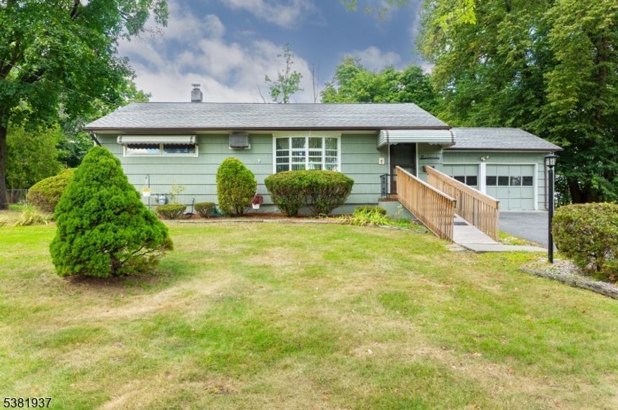 Welcome to this inviting ranch-style home that combines warmth, space, and opportunity. Set on a generous, tree-lined lot, this home offers wonderful curb appeal with mature landscaping, a charming front entry, and an accessible ramp leading to the covered porch. Step inside to find a sun-filled living and dining area highlighted by a large picture window, fresh carpeting, and plenty of natural light. The cozy kitchen, accented with wood cabinetry and a breakfast bar, flows easily into the main living spaces, making it perfect for everyday living and entertaining. A Family Room with fireplace and tiled flooring adds extra space for relaxation, hobbies, or gatherings year-round. The bedrooms are comfortable in size, while the lower level features a spacious basement ready to be transformed into a rec room, gym, or home office. Outside, the flat, fully usable yard is ideal for gardening, play, or summer barbecues, with a screened porch and deck offering the best of indoor/outdoor living. Completing the package is an attached garage and long driveway for easy parking. This well-loved home offers incredible potential move right in or bring your design ideas to create the space you've always dreamed of. Conveniently located near schools, parks, shopping, and commuter routes, this is a rare opportunity to own a home with space, character, and value in today's market.