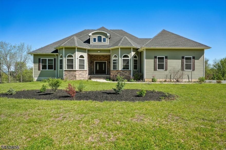 Welcome to 47 Asbury Rd a stunning custom-built home completed in 2023, perfectly situated on two acres with breathtaking views in desirable Independence Twp. Thoughtfully designed with both luxury and functionality in mind, this home features an open-concept floor plan filled with natural light and soaring 10-foot ceilings throughout the first floor. The heart of the home is the inviting family room with a cozy fireplace, seamlessly flowing into the main living spaces, creating the perfect setting for everyday living and entertaining alike. This spacious home offers 3 bedrooms and 3 full baths, along with a finished second floor featuring three additional rooms, including a large recreation room with incredible potential for an in-law suite, guest quarters, home office setup, or additional living space. The massive unfinished basement with 10-foot ceilings offers endless possibilities for future finishing and customization. Additional highlights include a 2-car garage, beautiful exterior stonework, a large rear deck overlooking the peaceful property, and a rare combination of modern construction, privacy, and scenic surroundings. A truly special opportunity to own a newer custom home with room to grow both inside and out.