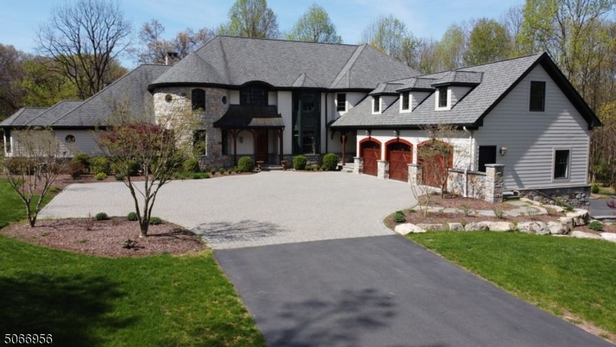 Stunning custom 9931 sf home on 56 farm assessed private acres accented by trees, pastures & open fields, with 8 car attached garage & 8 stall barn with 2 bedroom apart, workshop, tack rm., wash stall & hay loft! The 1st. flr. offers MBR suite with FP & access to patio. Master bath with access to gym & steam room, spectacular 2 story great room with FP, large windows & doors leading to bluestone patio & stone FP, family room with FP wood beams, gourmet kitchen with 60 inch range, granite counters, center island with farm sink & wine ref., dining area with access to deck, In-law-suite & laundry. 2nd flr. features: ensuite, 2 add. bedrooms connected by a bath & Au Pair Suite. Full house generator. Radiant heat. Home is readily adaptable to off grid sustainable living w/multi source heating system, oil & wood.