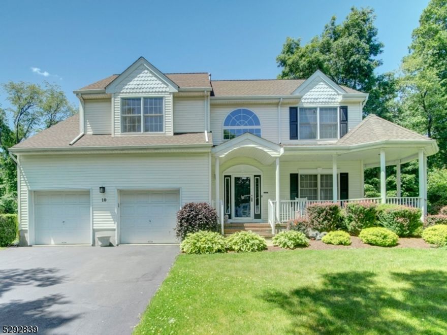 Beautifully updated and well maintained home located on a cul-de-sac street boasts a gazebo style front porch, grand 2 story foyer, gorgeous kitchen with granite countertops, stainless steel appliances, pantry, double wall oven & french doors that lead out to deck/yard that is perfect for entertaining. Family room has fireplace, moldings & high quality laminate flooring and is adjacent to kitchen Formal living room and dining room have same updated flooring as family room and are a plus for entertaining. Second floor features Impressive primary en suite bedroom with vaulted ceiling, 2 huge walk-in closets plus a third and beautiful bath. Second floor laundry is a big bonus here!  Three other spacious bedrooms and updated full main bath complete the second floor.  Additional plusses here are the full, finished basement, 2 year old roof, and dual zone a/c unit (one A/C from 2022). The yard is lined with beautiful trees for privacy, and the landscaping is plush and well maintained. All public utilities here! Fantastic value in highly desirable Poets Peak--a must see!