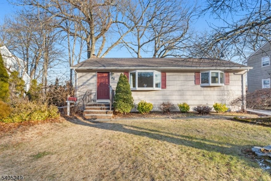 Move right into this beautifully maintained home situated on a prime, level, landscaped lot. The main level welcomes you with a tiled foyer leading to a sun-filled living room and hardwood floors throughout. The oversized eat-in kitchen is a highlight, equipped with stainless steel appliances, a modern tile backsplash, and sliding doors that open to an expansive private deck. Two spacious bedrooms and an updated full bath complete the first floor. The completely remodeled basement is a showstopper, offering a huge recreation area, a full custom wet bar, a half-bath, and massive storage space. With fresh moldings and a modern aesthetic in every room, this home is a rare find. Just pack your bags!