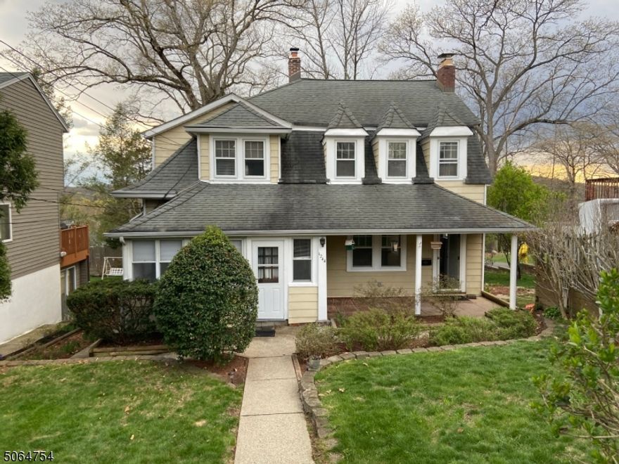 Totally renovated duplex on quiet residential street with tons of amenities and privacy. This won't last. Hardwood floors, wood burning fireplace in the living room. Kitchen beautifully appointed with brand new SS appliances, granite countertops, pantry, and 1/2 bath. Exposed beam ceiling and skylight add sunlight and character to kitchen and dining areas. Sliders open to private deck secured with entry gate; steps lead to shared yard and patio. Additional access to unit from yard via basement-level mudroom with sink and storage area - perfect for securing bikes and outdoor furniture. Laundry in basement. Tons of storage in basement and attic. Front of house features covered, private sitting area. New windows being installed (currently on back order). Off-street parking for two cars.