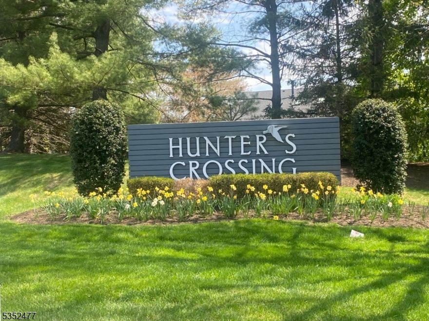 This highly sought after Hunters Crossing upper level condo is ready for a new owner.  Upon entering this home and to the left there is a glass double door entry into a den. The den can be utilized as a TV room, office or a second bedroom. This room has skylights in the ceiling and luxury vinyl plank flooring.  The eat in kitchen features stainless steel appliances and  new luxury vinyl plank flooring that leads into the dining room.  The dining room is open to the carpeted living room area. The living room has a ceiling fan and a sliding glass door that leads out to a deck that provides a private tranquil space overlooking a wooded area.  The large primary bedroom has a ceiling fan and an oversized closet.  This unit has replaced triple pane windows (2018)and an updated / remodeled bathroom. The bathroom has custom tile work in the tub shower with a rain shower head.  This home is freshly painted and ready for a new owner.