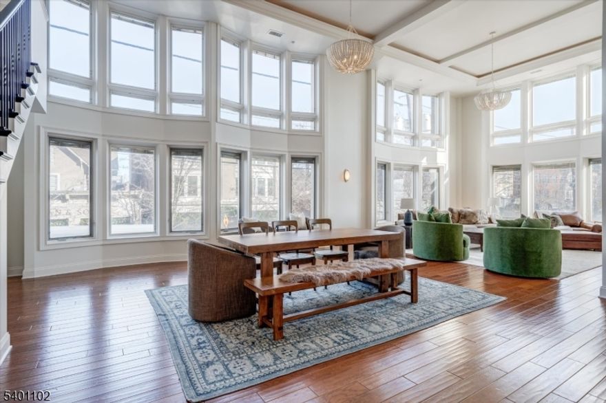 This expansive 1,769-square-foot loft offers the kind of space and light that's hard to find in Montclair, especially this close to the train. Located just steps from the station, it's an easy setup for anyone commuting into Manhattan while still wanting room to breathe at home.Inside, the open layout is anchored by soaring 16-foot ceilings, hardwood floors, and oversized windows with built-in blinds that bring in steady natural light throughout the day. The kitchen blends function and warmth with custom walnut cabinetry, stainless steel appliances, stone countertops, and a generous breakfast bar that works just as well for everyday meals as it does for entertaining.The bedrooms are well-proportioned and include custom closets, while the home offers two full bathrooms plus a convenient powder room near the entry. Upstairs, the second level provides flexible space that can be reimagined or expanded depending on how you live and work.Walnut Street Lofts includes practical conveniences that make daily life easier: in-unit laundry, deeded basement storage, and an assigned indoor parking space with charging stations, along with a second gated outdoor spot. Step outside and you're immediately connected to Montclair's restaurants, markets, arts scene, and Brookdale Park   all without sacrificing quick access to the city.