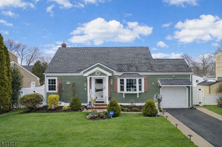 Absolutely beautiful cape situated in the desirable Milton Lake section in the popular town of Rahway! From the minute you enter this immaculate home you will be captivated by the upgrades and attention to detail throughout. The living room has a bay window and open floor plan to the dining room and kitchen. There are 4 spacious bedrooms and the finished basement has a family/theater room and game room that you must see to believe! The generous backyard has a large deck and new vinyl fence. Newer items include all the windows, furnace, central air, HWH, appliances, new front sidewalk and gutters with leaf guards and so much more...THIS IS A MUST SEE HOME!