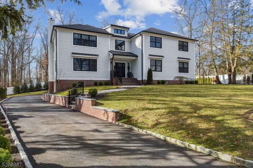 Located in desirable Rolling Hill, this custom farmhouse colonial was built in 2020 with attention to upscale design and unsurpassed detail. This home features custom shiplap and recessed picture frame paneled walls, white oak flooring throughout, crown molding throughout, designer light fixtures & feature walls of brick which give that extra touch to special rooms. Step into the grand living space with soaring ceilings, spacious rooms, custom built-ins, walls of windows and sliding glass doors. A seamless flow that is perfect for entertaining and relaxation. The open-concept kitchen includes premium appliances, a generous island, Sub-Zero refrigerator and beverage cooler, Wolf 48 inch range/oven, and a farmhouse sink. A home office and guest suite are strategically situated and provide ample space and privacy. An architecturally striking staircase leads to the upper level featuring an expansive landing area and double-doored primary suite with lavish en-suite that provides a large shower, soaking tub and a massive custom walk-in closet. There are three additional bedrooms upstairs and a beautiful laundry room. The home is rounded out with a 1300 sq.ft. lower level that houses a custom mudroom and large rec area with high ceilings that make this a wonderful place for fun!! Improvements include: Three brick accent walls, full house generator, house water filter, garbage disposal, black fence in backyard, updated interior & exterior lighting, room darkening blinds in bedrooms.