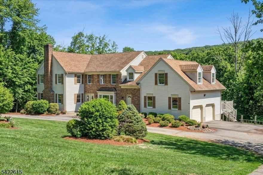 Stately 4-5 Bedroom, 3 Full Bath Newer Center Hall Colonial Situated On A Quiet Residential Cul-De-Sac, Set On A Very Private 3-Acre Property. This Impressive 3,642 Sq. Ft. Home Features A Thoughtfully Designed Floor Plan, Highlighted By A Grand Entry Foyer And A Spacious Eat-In Kit. The FR Offers A Gas FP, Soaring Vaulted Ceilings w/Sliding Doors From Both The Kitchen And FR Leading To An Expansive 50-Foot Composite Deck Overlooking A Serene, Super Private Backyard.The Main Level Also Includes a Formal LR w/a Wood-Burning FP, a Large Formal DR + a Full Bath w/Adjacent Office, There is Also a Large Mudroom Provide Additional Convenience w/Direct Access To An Oversized Two-Car Attached Garage Featuring Tons of Extra Storage Space + a Separate Staircase Leading To A Private Second-Level 26' X 21' Bonus/Playroom w/Attractive Beamed Ceiling. An Elegant Open Staircase Leads to the 2nd Floor, Which Includes 4 BR's a Large Bonus Rm a Spacious Primary Suite Complete w/2-Walk-In Closets and a Beautifully Updated Bath Featuring An Oversized Shower, Soaking-Tub, Double Sinks, High Ceilings w/Skylight. Additional Highlights Include a Partially Finished Full Walk-Out Basement w/a Custom Bar Area, Brand New Septic System (2019), Newer 2-Zone Gas Heat & CAC & 22KW Whole-House Gas Generator. Hardwood Flooring Runs Thru-Out The Home, Complemented By a Convenient Circular Driveway w/Extra Parking Space  & Located In A Desirable Neighborhood Within A Top-Rated, Blue Ribbon School District.