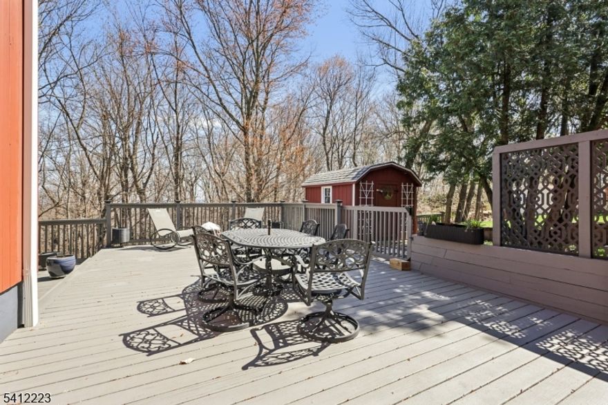 The Heights awaits! This beautifully updated 3-bedroom, 2.5-bath ranch blends effortless comfort with timeless style inside and out. Tucked away on a private lot along one of the neighborhood's most coveted streets, this home offers the perfect balance of serenity and convenience.Step inside to find gleaming hardwood floors throughout, elegant crown molding, and a gracious living room anchored by a classic wood-burning fireplace. The modern kitchen has been tastefully updated for today's lifestyle, while central A/C ensures year-round comfort.Practical upgrades provide peace of mind, including a newer roof and gutters, generator hook-up, and an attached, heated two-car garage. The finished walk-out basement complete with vinyl flooring and a half bath adds versatile bonus space ideal for a home office, gym, or recreation area. Out back, a spacious two-tiered deck sets the stage for effortless entertaining or quiet evenings under the stars. And the expansive rear family room? That's the icing on the cake.Enjoy close proximity to all that Bergen County has to offer, including the charming downtown of Hawthorne and convenient NJ Transit train access yet come home to a setting that feels miles away from it all.Whether you're downsizing or planting roots, this one is a slam dunk.