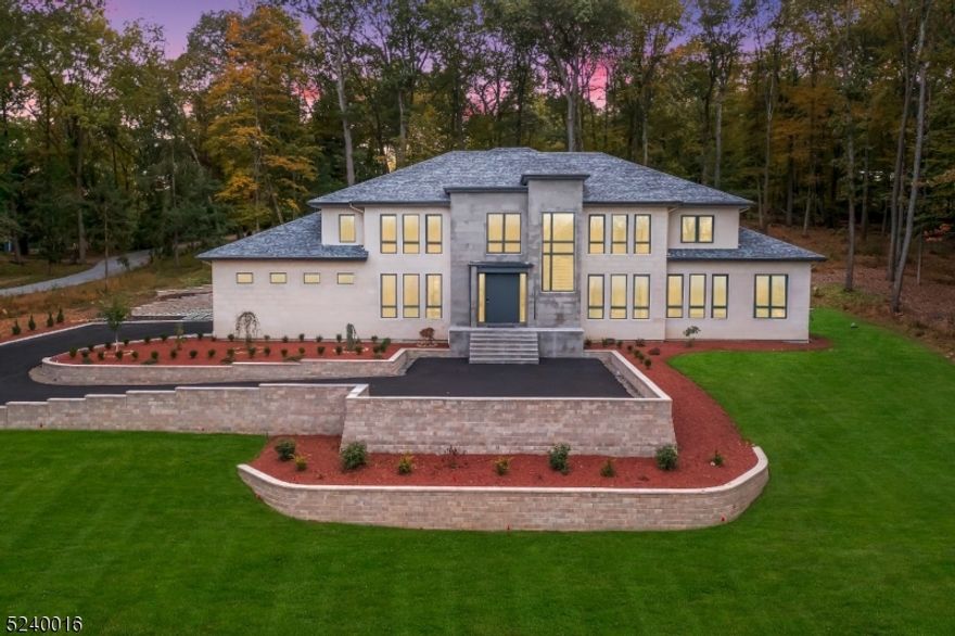 Nestled in prime Bernardsville, this newly built residence blends cutting-edge home with contemporary design, offering an unparalleled living experience that seamlessly integrates modern aesthetics and flawless perfection. Don't miss the chance to explore this extraordinary home that promises a breathtaking lifestyle you won't want to overlook. Given the extensive range of features, here are a few notable highlights, Portuguese Limestone exterior, grand foyer w/Sintered 3x6 stone floor, 6x9 Metal pivot entry door, modern floating staircases w/glass railing & LED lighting. DR w/glass temp control wine cellar, great room with Ethanol fireplace & built-in freshwater tank surrounded w/ blue onyx floor to ceiling, German top-of-the-line kitchen by Leicht, Chef pantry & all appliances by Gaggenau. The sliding door opens overlooking 55 ft. long heated salt-water pool w/ infinity edge & spa. Family room w/built-in furniture; bookshelves w/ethanol fireplace & pandora marble. Bathrooms w/ wall hung toilets, made by Duravit & Geberit. 1st floor Master w/ 16ft sliding door, sitting area, book match marbles, large bathroom w/ free-standing tub, his/her showers, dual vanity, makeup area & WIC. 2nd level boasts 3 bedrooms w/ baths, one room can be converted into a loft, 2nd master includes Italian wide plank HW floors, free standing tub, makeup area. 2nd family room w/ bookshelves, sliding doors, ethanol fireplace & grey marble.