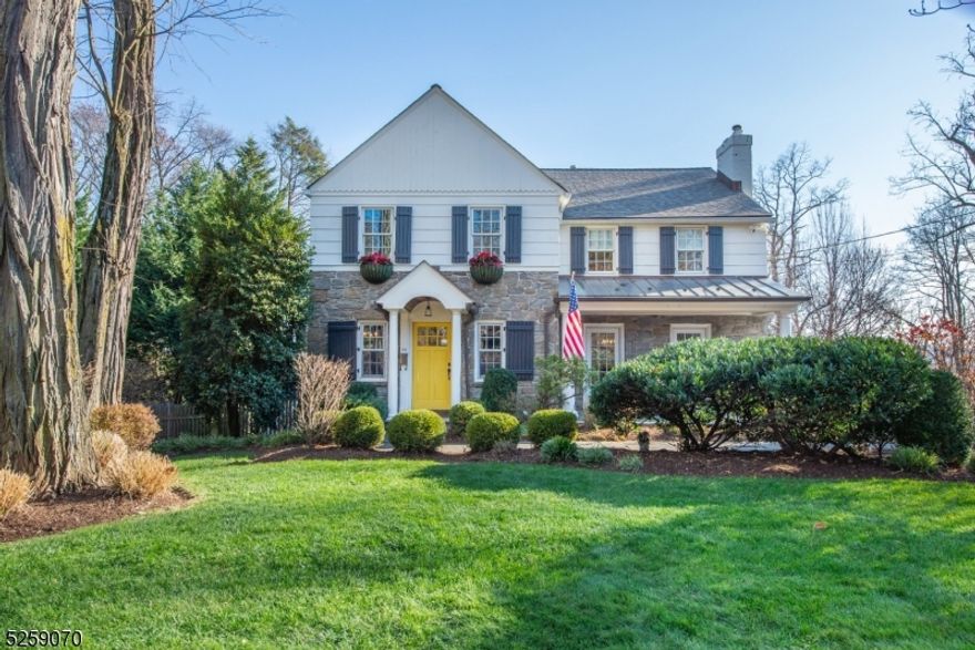 Welcome to an enchanting residence in the heart of Short Hills, a fusion of sophistication & charm.This 4-bed, 4.5-bath home, set on.33-acres invites you into elegance & comfort. A picturesque blue-stoned porch adorned w/ flower boxes & striking yellow door sets the tone for the beauty within. The foyer graciously leads to LR and DR bathed in natural light. Meticulous craftsmanship weaves throughout, highlighted by lighted built-in cabinets. The FR, adorned w/ Phillips Jeffreys wallpaper, connects to the kitchen featuring SS appl & quartz peninsula. The open floor plan extends to an eat-in area w/ banquet,offering ample storage for style & functionality. The   screened-in porch creates a flow for entertaining & providing space to enjoy the outdoors. The 2nd floor unveils 4 beds&3 full baths,all thoughtfully designed. Stairway access to the unfinished attic offers expansion opportunity. The basement features laundry, exercise room, & full bath. The versatile rec space & addl area w/ wet bar is an enticing prospect for entertaining space or office/bedroom. This level connects to 2-car garage & direct access to the backyard. A deep backyard featuring a deck, patio & koi pond are a perfect haven for relaxation & outdoor entertainment. Amenities include a generator, sprinkler system, exterior camera system & fully fenced yard w/ electronic gate for privacy & security. This residence seamlessly blends classic charm w/ modern amenities, promising a lifestyle of luxury & convenience.