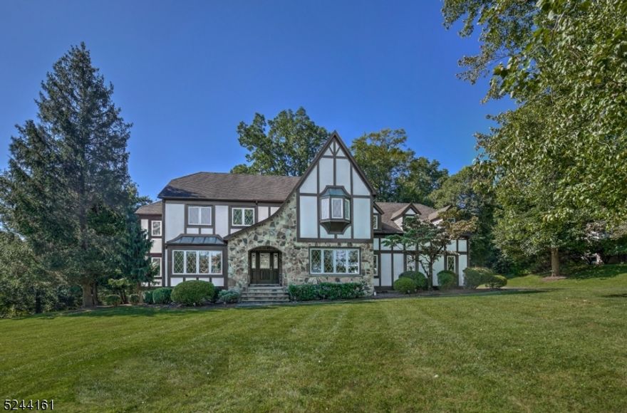 This elegant 5 bedroom, 3.5 bath colonial is located in The Summit, one of Morris Township's most sought after neighborhoods.  The gracious floor plan with hard wood floors throughout and generously sized rooms offers an ideal layout for both entertaining and everyday living.   The large living and dining rooms flank the foyer and lead to the dramatic two story family room that sits at the center of the home. The spacious eat-in kitchen with center island, pantry and an abundance of cabinets has sliding French doors that lead out to the deck.  The first floor office with built-in bookcases is bright and sunny and perfect for working from home. A first floor laundry room boasts a storage closet, utility sink and entrance to the rear yard. and sits across the rear foyer from the powder room.  The second level offers 5 very spacious bedrooms, including a large primary suite with oversized walk-in closet and light and airy bath with cathedral ceiling and skylight.The finished lower level with full bath, wet bar with wine fridge, large rec area and separate exercise room provides great space for fun and relaxation.  A three car oversized garage has ample space for vehicles and storage.  Perfectly situated just minutes from Morristown's vibrant center with dining, shopping and the NYC mid town direct train line, this wonderful stately home has it all!