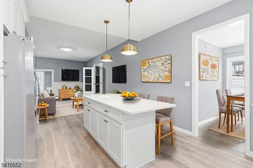 Brand new everything in this gracious and airy 4+ bedroom unit across from the lake! Enjoy the chef's kitchen with gleaming center island, stainless appliances and endless counter space; family room, four full bedrooms with an office, a den and two freshly renovated bathrooms in this beautifully renovated apartment - with a water view! New luxury flooring and fresh paint on every wall. Laundry in unit, garage and driveway space, and a shared yard check off every item on your list. Close to schools, houses of worship, local shopping and dining in nearby Hopatcong and Dover, and the best outdoor recreation NJ has to offer.