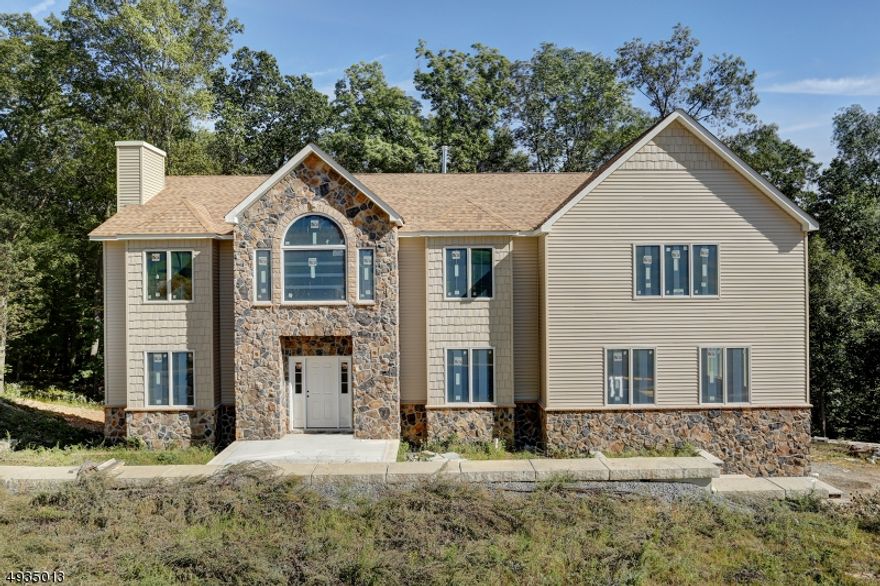 Stunning new construction. Double story foyer and hardwood floors on first level, fireplace in family room, Open kitchen and great room, perfect for entertaining. Bedroom and full bath on 1st floor. Over 4,400 square feet. This home had 4 full baths with a Jack and Jill upstairs. Amazing floor plan. Ready to pick your own colors and customize. High ceilings in basement and sliding glass doors to outside. The pictures on line are for the home next door. Arches are an upgrade. 9 Lots left from over 20 lot subdivision. Puddingstone has 2 cul de sac streets.