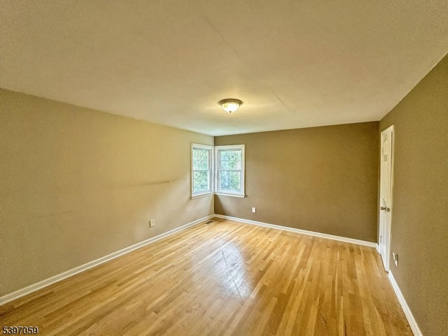 Welcome to this beautifully refreshed colonial home, offering approximately 2,616 sq ft of thoughtfully designed living space. Built in 1951 and set on a generous 0.37-acre lot, the residence BOAsts 4 bedrooms and 3 baths delivering the perfect blend of classic charm and modern upgrades. A welcoming front porch with Trex decking invites you into an open main level, where crown moldings, rich wood floors and a cozy fireplace set the tone for warm gatherings. The granite-and-stainless kitchen serves as the heart of the home, flowing seamlessly into dining and three-season rooms for extended leisure and entertaining.Upstairs, you'll find a spacious primary suite with dual walk-in closets and a private bath, alongside light-filled secondary bedrooms ideal for  home-office use. Outside, the lush yard gives generous room or your business-partner lifestyle. Conveniently located in sought-after Clark Township, this home resides in the highly rated local school district and is set within the desirable R-150 zoning district. Don't miss your chance to own this turn-key gem in a premier Union County neighborhood.