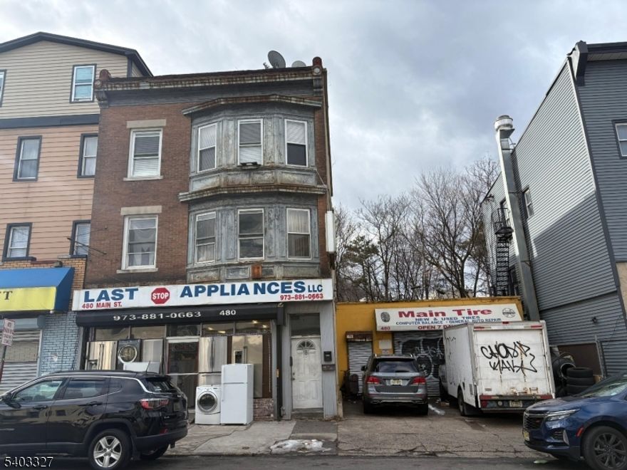 Mix Use Property, commercial space in the first level currently occupy by an appliance store and 2 - 4bedroom units in the 2nd and 3rd floor currently rented. This can also be sold as a package with 478 Main St Paterson NJ for an additional price.