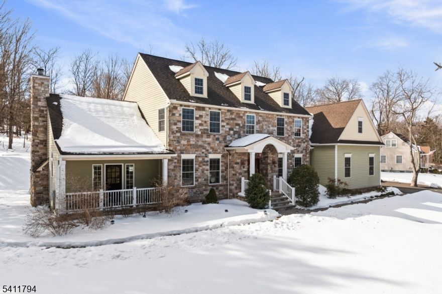 Welcome to this immaculate stone front colonial with beautiful, custom features throughout. As soon as you enter the two story foyer, you start to understand why this home is so special. You immediately see the 8-foot doorway leading to your chef's kitchen complete with a massive island, gorgeous cabinetry, and high-end appliances including a 36 inch DCS 6-burner range. The living spaces have hardwood floors throughout including an impressive family room, which also features a gas burning fireplace, access to a covered front porch, and custom moldings - including a beautiful coffered ceiling. There is a bright sunroom with a door to the patio, a first floor office, full bathroom, and access to a 3-car garage to complete the first floor. The second floor features hardwood floors throughout the hallway and bedrooms. The primary suite offers a tray ceiling, multiple closets, and a 4-piece en suite bathroom with marble countertops on the double vanity. There are two spacious bedrooms that share another full bathroom and a secondary suite for the 4th bedroom, complete with a full bathroom and massive 16-foot walk-in closet. The finished basement offers ample additional living space. There is a rec room, built in kitchenette with a sink and wine fridge, and an additional bonus/office space. Some other features include a motorized chandelier lift, crown molding, craftsman style two panel doors, jetted tub, & 2-zone HVACs. Over $120k in upgrades in the last year.