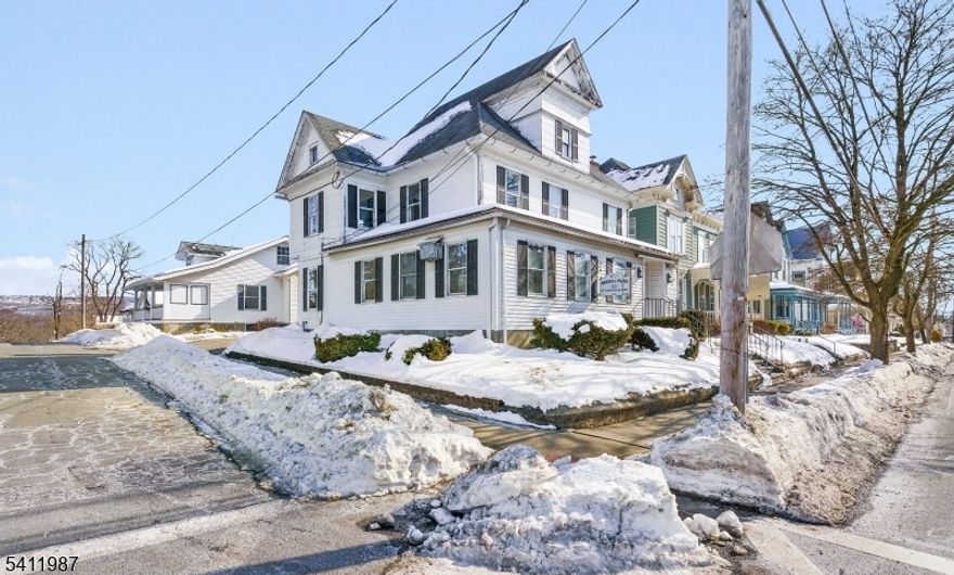 Located in Hackettstown's Residential Office zone, with adjacent properties already utilized as residential homes, this historic property offers a compelling opportunity to restore a classic residence just one block from vibrant Main Street. Currently configured for professional office use, the building retains the character and layout of a traditional home and already includes a full bath on the second floor, a walk-up finished attic and a finished basement,  providing multiple levels of functional living space and making a return to residential use easily achievable. Original chestnut trim, preserved millwork, and a grand staircase showcase the timeless craftsmanship and architectural detail that define this era of construction, while the flexible interior layout allows for the creation of spacious living areas, bedrooms, and modern amenities tailored to today's lifestyle. Enjoy the convenience of being steps from Main Street's restaurants, breweries, coffee shops, boutiques, and year-round community events, as well as proximity to Centenary University. With easy access to major roadways and NJ Transit rail service for commuting, this location blends walkable downtown energy with neighborhood charm, offering a rare chance to create a distinctive home in one of Hackettstown's most desirable settings.