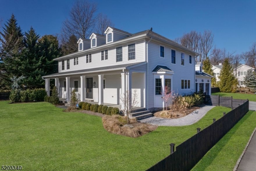 Classic newer construction with architectural details renovated in 2020. Welcoming front porch with an amazing entry foyer. Grand scale rooms and a classic layout conducive to entertaining. Chef's kitchen with high end appliances and an oversized center island. Great room opens to a large stone patio and private fenced in yard. The second floor has five bedrooms, including a master suite and a laundry room. Fabulous lower level with recreation room, exercise room, wine cellar and full bath. Interior design by Ash and Pine Interiors.  Conveniently located  to schools and New York City Midtown Direct train line.  A true gem.