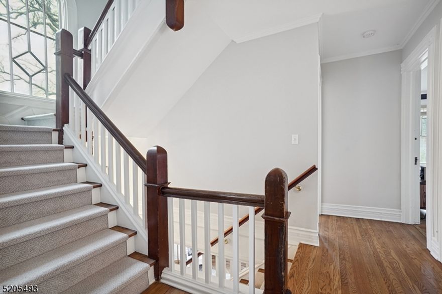 This romantic C1890 Victorian Style home with it's expansive covered front porch and ceiling fans is within two blocks from  Summit's vibrant downtown with an array of shops, wonderful restaurants and commuter service to NYC. Extensive renovations throughout in 2017, it marries the romance of its historic era with modern day amenities. Nine foot ceilings on the 1st & 2nd levels with new oak flooring throughout both levels, new  drywall, exterior painted some new windows.  Kitchen is a true Chef's delight, offering a heated cork floor, Decora cabinetry, beadboard ceiling, a massive Galley Workstation, Wolf stove, DBL wall ovens, Sub Zero fridge, wine fridge, Bar sink. Sliders open to 3 season porch.  Five bedrooms, 3 full and 3 half baths three of which have heated floors. Lower level offers a rec room and a 1300 bottle temperature controled wine cellar .The two car garage offers a large second-floor heated and air-conditioned room suitible for a home gym/ studio/  home office or playroom, plus a half bath. Other features include an extensive Sonos system, sitting porch off one of the bedrooms, custom fitted closets, pocket doors.  Level lot, Sidewalks.